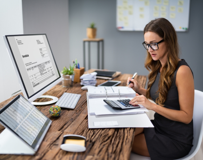 Accountant calculating tax using accounting software